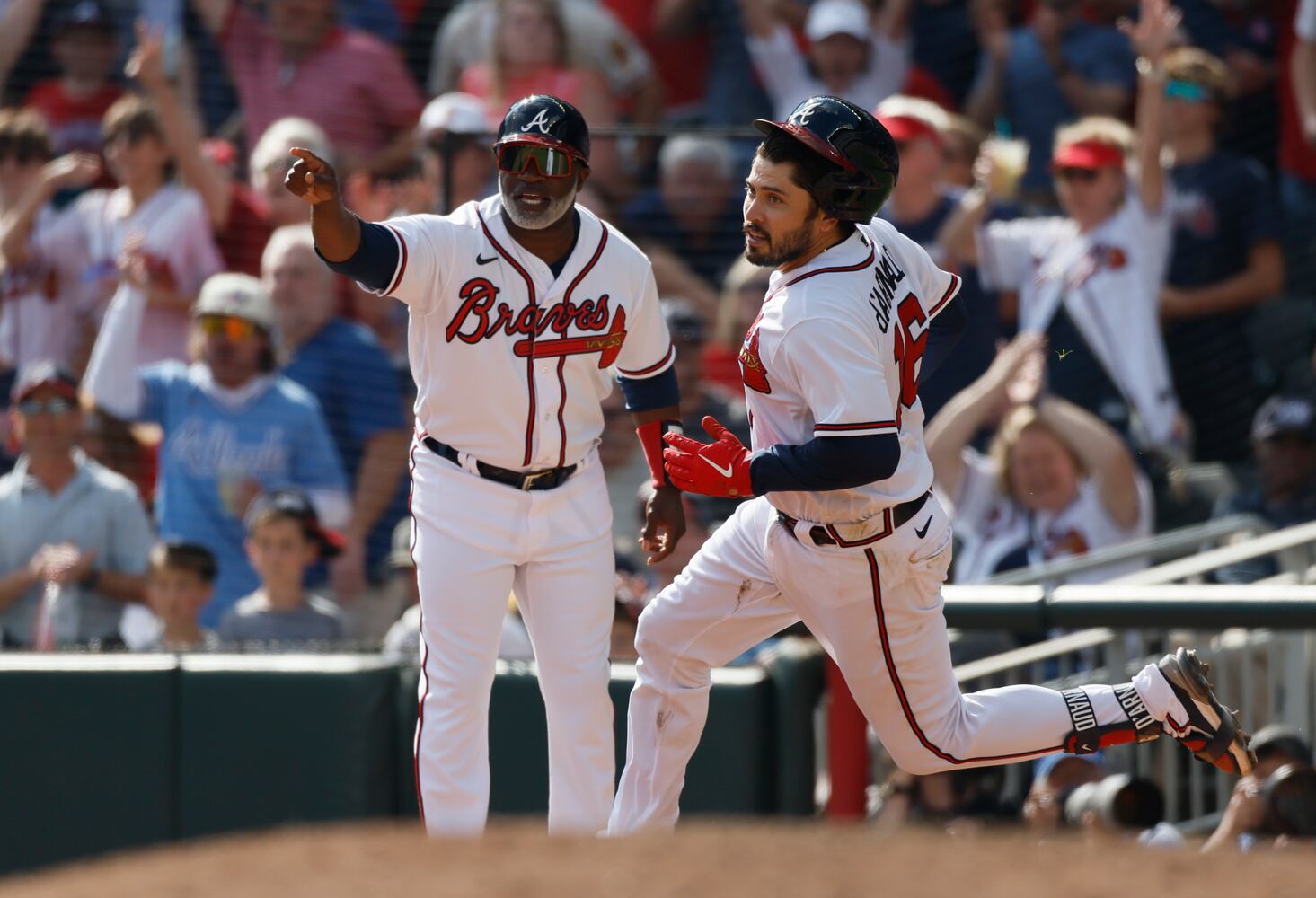 Atlanta Braves' Travis d'Arnaud doubles to score Matt Olson and William Contreras during the fifth inning of game one of the baseball playoff series between the Braves and the Phillies at Truist Park in Atlanta on Tuesday, October 11, 2022. (Jason Getz / Jason.Getz@ajc.com)