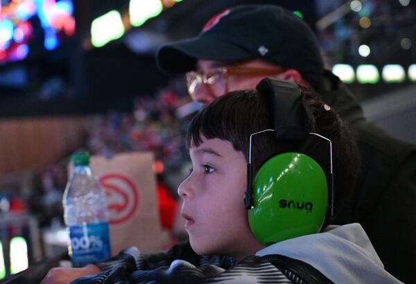 A young fan reacts as he watches Donuts competition during Hot Wheels Monster Trucks Live at State Farm Arena, Saturday, December 6, 2024, in Atlanta. (Hyosub Shin / Hyosub.Shin@ajc.com)