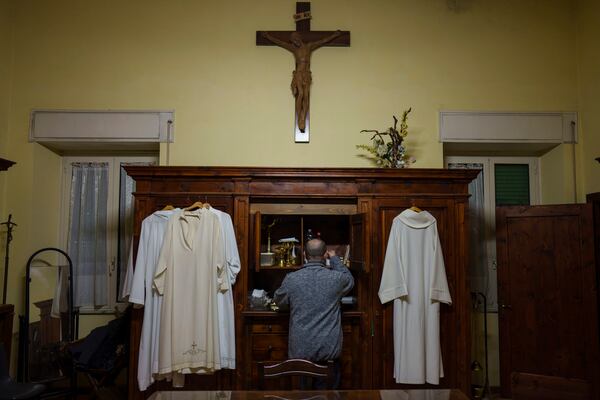 Priest Andrea Conocchia in the sacristy of the Beata Vergine Immacolata parish church in Torvaianica, Italy, Thursday, Feb. 27, 2025. (AP Photo/Bernat Armangue)