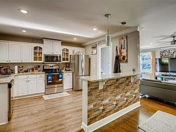 Refinished hardwood floors are throughout the main level.