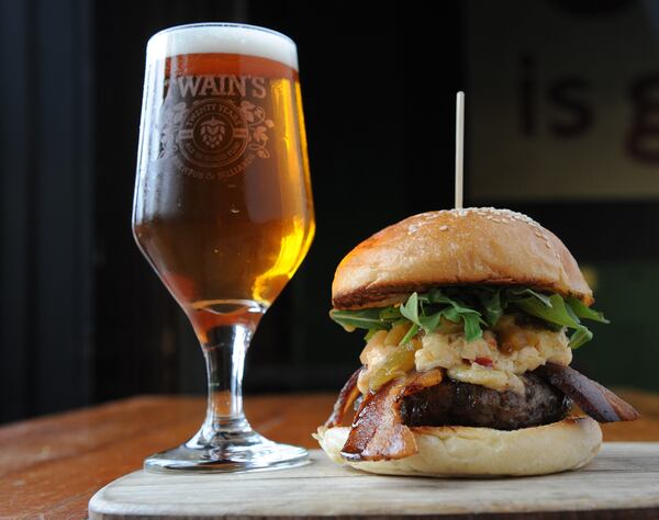 Olivia Burger- Pimento cheese, arugula, green tomato relish and bacon - is served with Pale Ale at Twain's Brewpub in Decatur. (Beckystein.com)