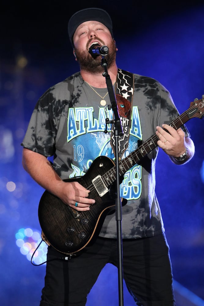 Mitchell Tenpenny performs as one of the opening acts when chart-topping Jason Aldean made a tour stop at Atlanta's Lakewood Amphitheatre on Saturday, August 5, 2023. (Photo: Robb Cohen for The Atlanta Journal-Constitution)