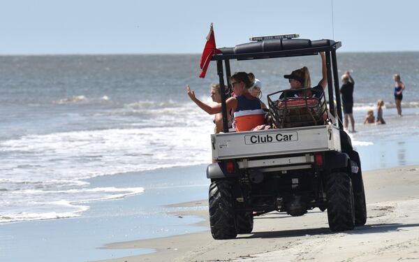 A Tybee Island Ocean Rescue crew keeps a close eye on swimmers because rip tides are likely making the waters dangerous as Tropical Storm Florence roils the nearby Carolinas on Friday, September 14, 2018. 