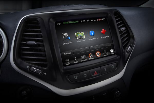 This product image provided by Fiat Chrysler Automobiles shows the Uconnect 8.4 inch infotainment system on a 2014 Jeep Cherokee Limited. Harman International, the company that makes car radios that friendly hackers exploited to take control of a Jeep Cherokee, on Tuesday, Aug. 4, 2015 said its other infotainment systems don't have the same security flaw. (Fiat Chrysler Automobiles via AP)