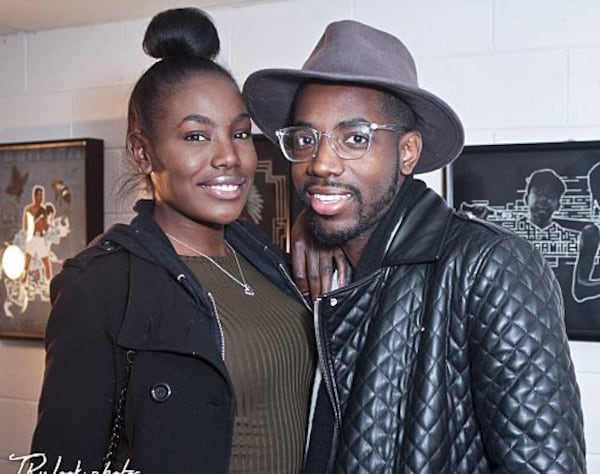 Patrons pose for a picture at Gill Gallery.