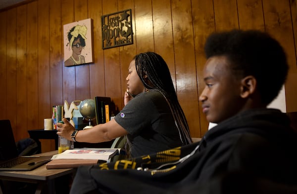 Tatiana Edwardsm (left), a student at Georgia Northwestern Technical College, had to get accustomed to pursuing her degree during quarantine. Edwards is a student at the college juggling work, raising two sons, Josiah (not in picture), 6, and Malachi (right), 15. Edwards is also the student government leader on campus. (Ryon Horne/RHORNE@AJC.COM)