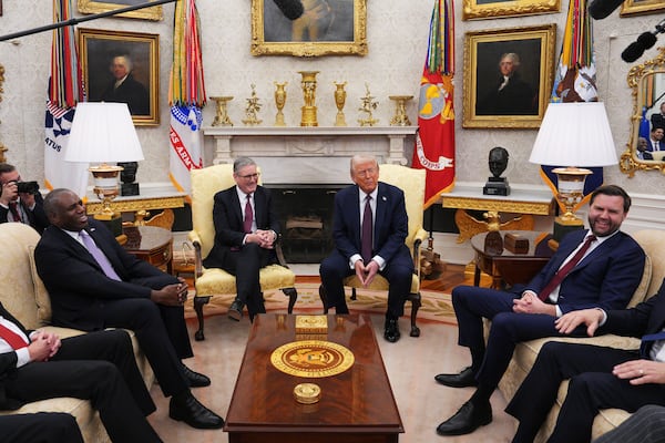 President Donald Trump meets with British Prime Minister Keir Starmer, center left, alongside U.S. Vice President JD Vance, right, and British Foreign Secretary David Lammy, left, at the White House, Thursday, Feb. 27, 2025, in Washington. (Carl Court/Pool via AP)