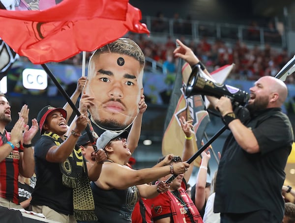 Atlanta United fans celebrate after forward Josef Martinez makes the MLS season record tieing goal, his 27th of the year, during a 3-1 victory over the Columbus Crew in a MLS soccer match on Sunday, August 19, 2018, in Atlanta. Curtis Compton/ccompton@ajc.com