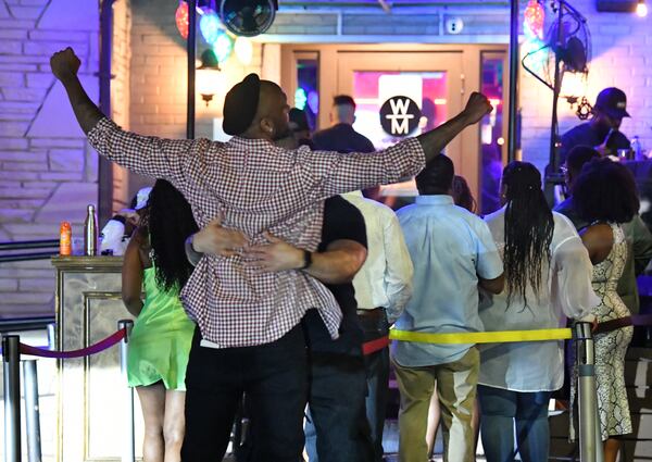 Guests go through a security check before going into Whisky Mistress in Buckhead on Saturday, April 30, 2022. (Hyosub Shin / Hyosub.Shin@ajc.com)