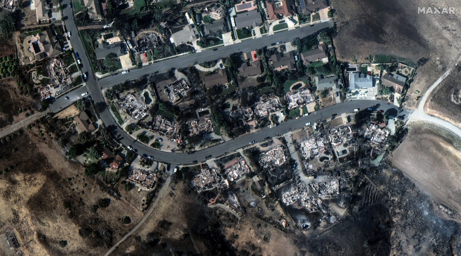 This satellite image released by Maxar Technologies shows fire-ravaged houses in Camarillo, Calif., on Thursday Nov. 7, 2024. (Satellite image ©2024 Maxar Technologies via AP)