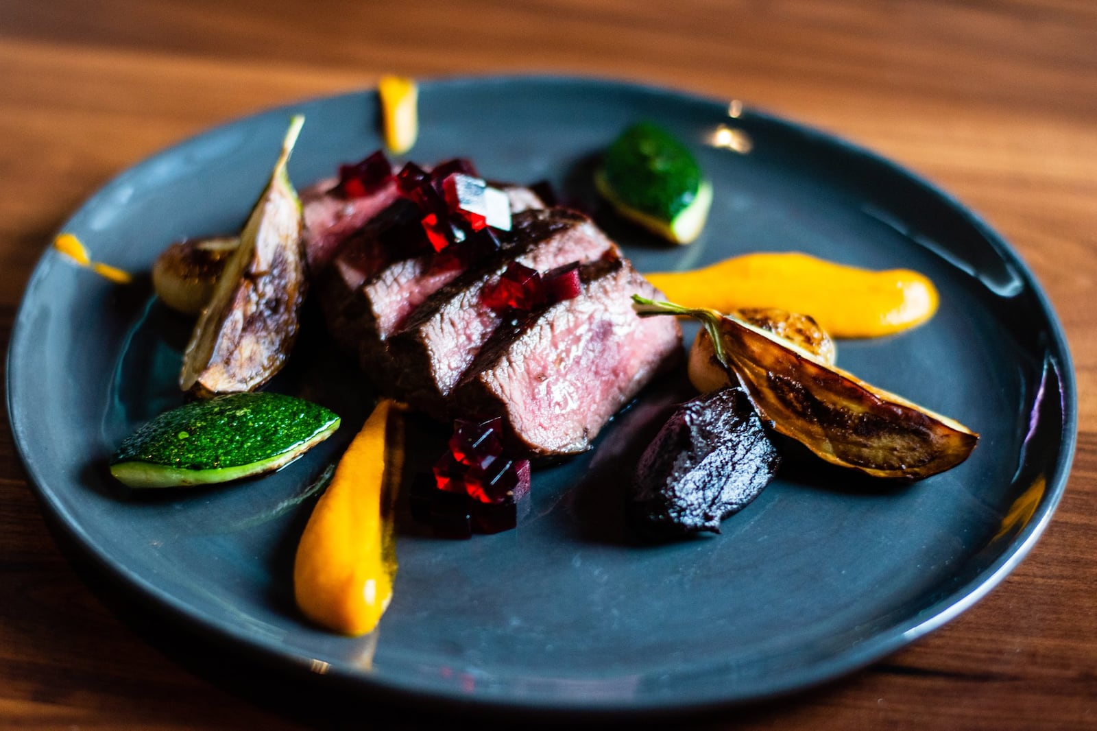 Coulotte steak at the Alden, served with summer squash, carrot puree, black onion jam and red wine jelly. CONTRIBUTED BY HENRI HOLLIS