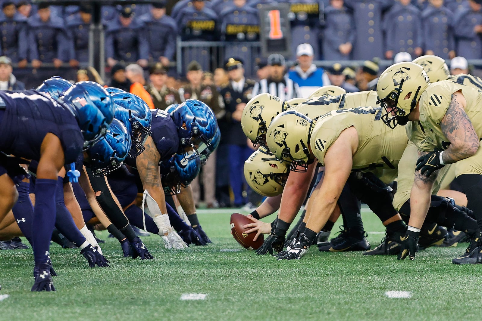 FILE - The Navy Midshipmen and the Army Black Knights line up for the snap at the line of scrimmage during the first quarter of an NCAA football game at Gillette Stadium Saturday, Dec. 9, 2023, in Foxborough, Mass. (AP Photo/Winslow Townson, File)