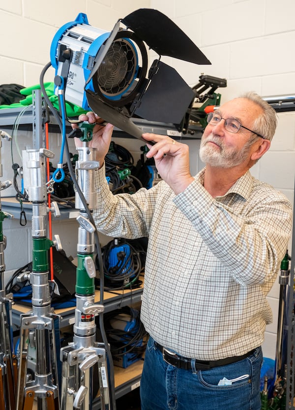 Retired motion-picture cameraman Clyde E. Bryan works with camera and lighting equipment at Trilith Studios in Fayetteville. He came out of retirement to work with the Georgia Film Academy teaching students about his craft. PHIL SKINNER FOR THE ATLANTA JOURNAL-CONSTITUTION.