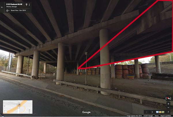 NOVEMBER 2016: This image from Google Maps Street View shows the underneath of I-85 where the interstate passes over Piedmont Road, looking to the northeast. The area marked in red is the northbound lanes. The section that collapsed is above the stacked coils of material seen at right. (Google Maps Street View)