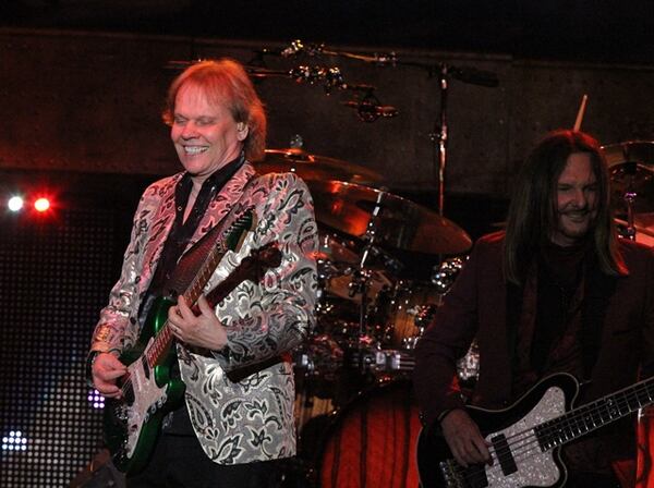 Styx's James "JY" Young shares a laugh with bassist Ricky Phillips at the band's May 26, 2019 concert at Chastain. Photo: Melissa Ruggieri/Atlanta Journal-Constitution