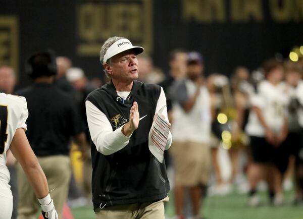 Colquitt County coach Rush Propst cheers on players after a touchdown in the second half against McEachern during the Corky Kell Classic at Mercedes-Benz Stadium on Saturday, Aug. 18, 2018, in Atlanta. Colquitt County won 41-7.  (Jason Getz/For the AJC)