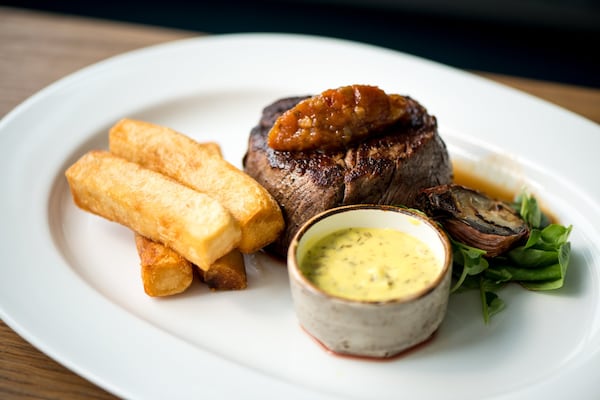 Steak Frites Filet Mignon with Sauce Bearnaise, and house made jumbo fries. Photo credit- Mia Yakel.