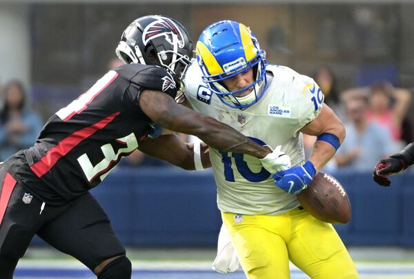 Rams receiver Cooper Kupp has the ball punched out of his arms by Falcons cornerback Darren Hall late in the fourth quarter at SoFi Stadium on Sunday. The Falcons recovered the ball. (Wally Skalij/Los Angeles Times/TNS)