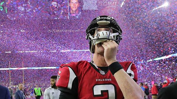 Falcons quarterback Matt Ryan reacts to losing the Super Bowl as the screen flashes Patriots quarterback Tom Brady and confetti flies in a 34-28 loss on Sunday Feb. 5, 2017, in Houston.