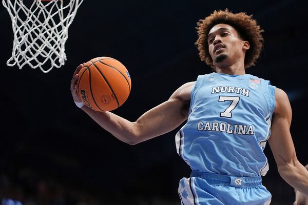 North Carolina guard Seth Trimble gets a rebound during the second half of an NCAA college basketball game against Kansas Friday, Nov. 8, 2024, in Lawrence, Kan. Kansas won 92-89. (AP Photo/Charlie Riedel)