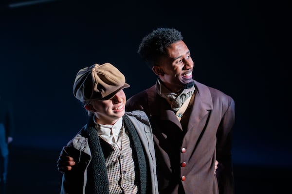 Abigayle Wright (left) as Tim Cratchit and Darvensky Louis as his father Bob perform a simple duet comprised of jaunty walks.