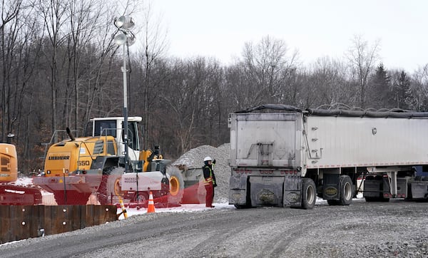 A tractor-trailer delivers stone and gravel to the site of the Feb. 3, 2023, Norfolk Southern freight train derailment, Monday, Jan. 22, 2024, in East Palestine. (Matt Freed for the Atlanta Journal Constitution)