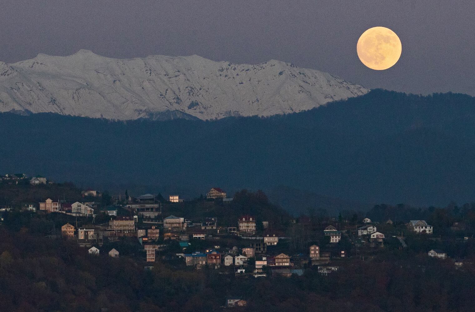 Photos: December full moon, the last of the decade, lights up the night sky