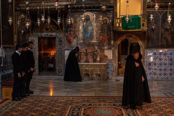 Armenian Christian clergy and young seminars attend the daily afternoon prayer service at the St. James Cathedral at the Armenian quarter in Jerusalem, Thursday, Nov. 21, 2024. (AP Photo/Francisco Seco)