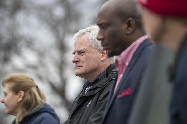 Jack Groh, executive director for the National Football League environmental program, listens before helping plant trees Tuesday at the Salvation Army Bellwood Boys and Girls Club in Atlanta’s English Avenue community. (ALYSSA POINTER / ALYSSA.POINTER@AJC.COM)