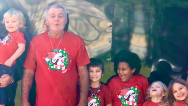 Steven Allen Payne, who died of lung cancer at age 63 in May, enjoyed spending time with his grandchildren. His corpse was among the 18 bodies found in varying stages of decomposition when authorities went to a funeral home in Douglas to evict its proprietor in late October. (Courtesy photograph)