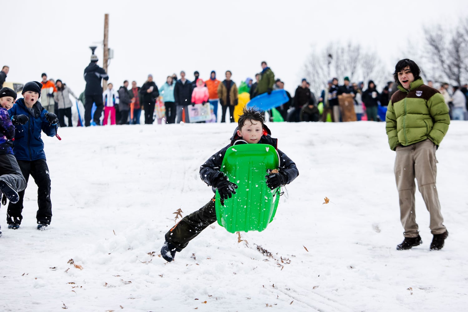 A young boy sleds at Piedmont Park in Midtown Atlanta on Friday, January 10, 2025. Two inches of snow fell on the Midtown area and Atlanta residents took advantage of it by sledding, throwing snowballs and building snowmen. CHRISTINA MATACOTTA FOR THE ATLANTA JOURNAL-CONSTITUTION.  