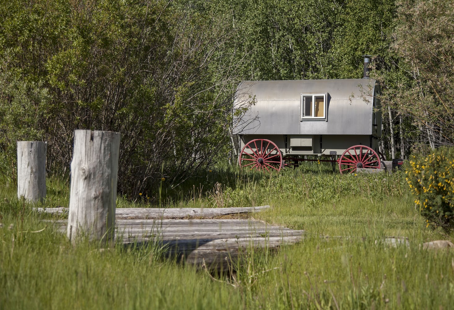 500-acre property has log cabins, mountain views