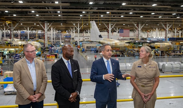 U.S. Deputy Commerce Secretary Don Graves, third from left, gives remarks after touring the Lockheed Martin C-130J production facility with James C. Stallings, director, Georgia Emergency Management Agency, from left, Rod McLean, vice president and general manager, Lockheed Martin and Vice Admiral Nancy Hann, deputy under secretary of operations, NOAA, right, in Marietta on Tuesday, Oct 22, 2024.  The Super Hercules aircraft produced here is built and outfitted for use as ‘flying laboratories.’ (Jenni Girtman for Atlanta Journal-Constitution)