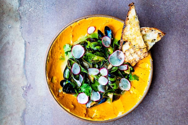 Leche de Tigre mussels with sweet potato-cumin mousse, cilantro and radish. CONTRIBUTED BY HENRI HOLLIS