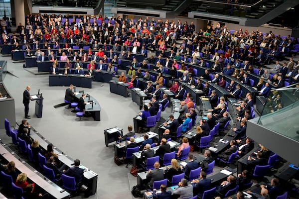 German Chancellor Olaf Scholz speaks during a plenary session at the German parliament Bundestag where he faces a vote of confidence, Berlin, Germany, Monday, Dec. 16, 2024. (AP Photo/Markus Schreiber)