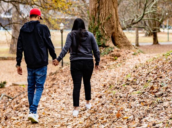 A humanitarian parole beneficiary from Venezuela sponsored by Sandra McAnany and her partner, enjoying the park near the Atlanta Botanical Garden, Dec. 17, 2023, in Atlanta, Ga. (Sandra McAnany via AP)