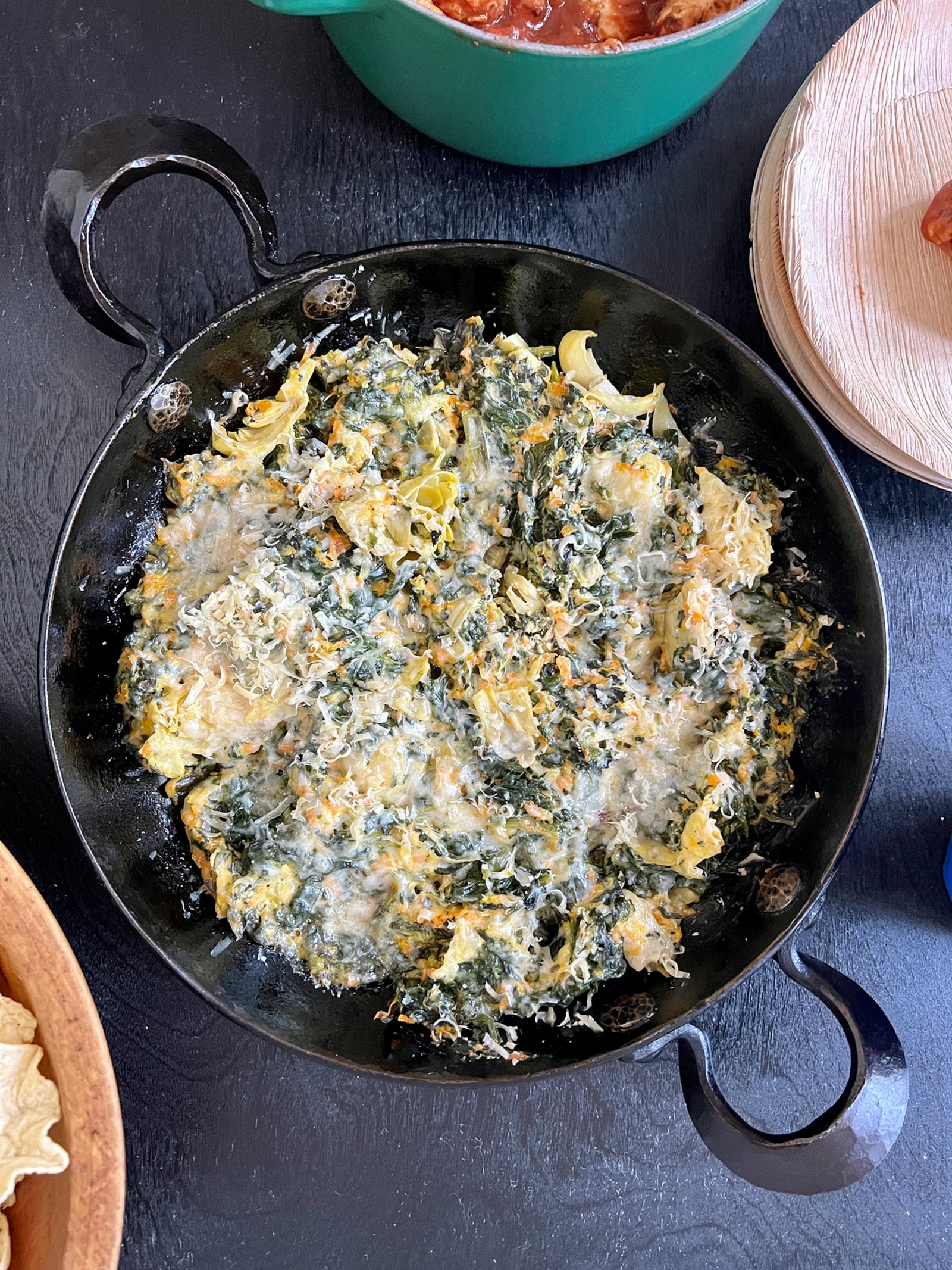 You can get an early start on your tailgating prep by assembling Makeover Spinach and Artichoke Dip a day or two early. (Virginia Willis for The Atlanta Journal-Constitution)