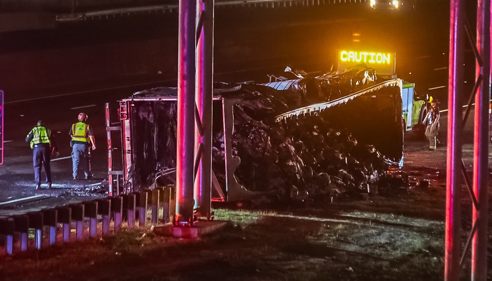 An overturned tractor-trailer blocked I-285's westbound lanes in Dunwoody early Tuesday morning.