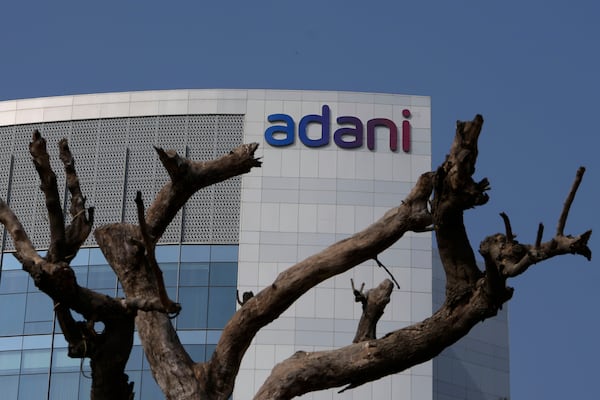 FILE- A tree with dried branches stands outside Adani Corporate House in Ahmedabad, India, Jan. 27, 2023. (AP Photo/Ajit Solanki, File)