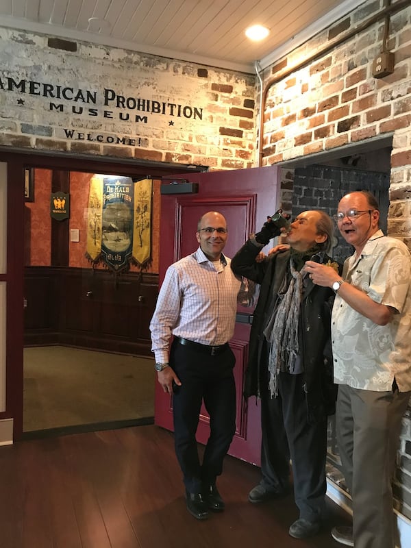 Old Town Trolley Tours general manager Charles S. Brazil (left) and Historic Tours of America President Edwin O. Swift III (right) pose at the entrance to the American Prohibition Museum. Historic Tours of America owns and operates this museum as well as historic attractions in Florida, Tennessee, Massachusetts, California and Washington, D.C. Photo by Ligaya Figueras. 