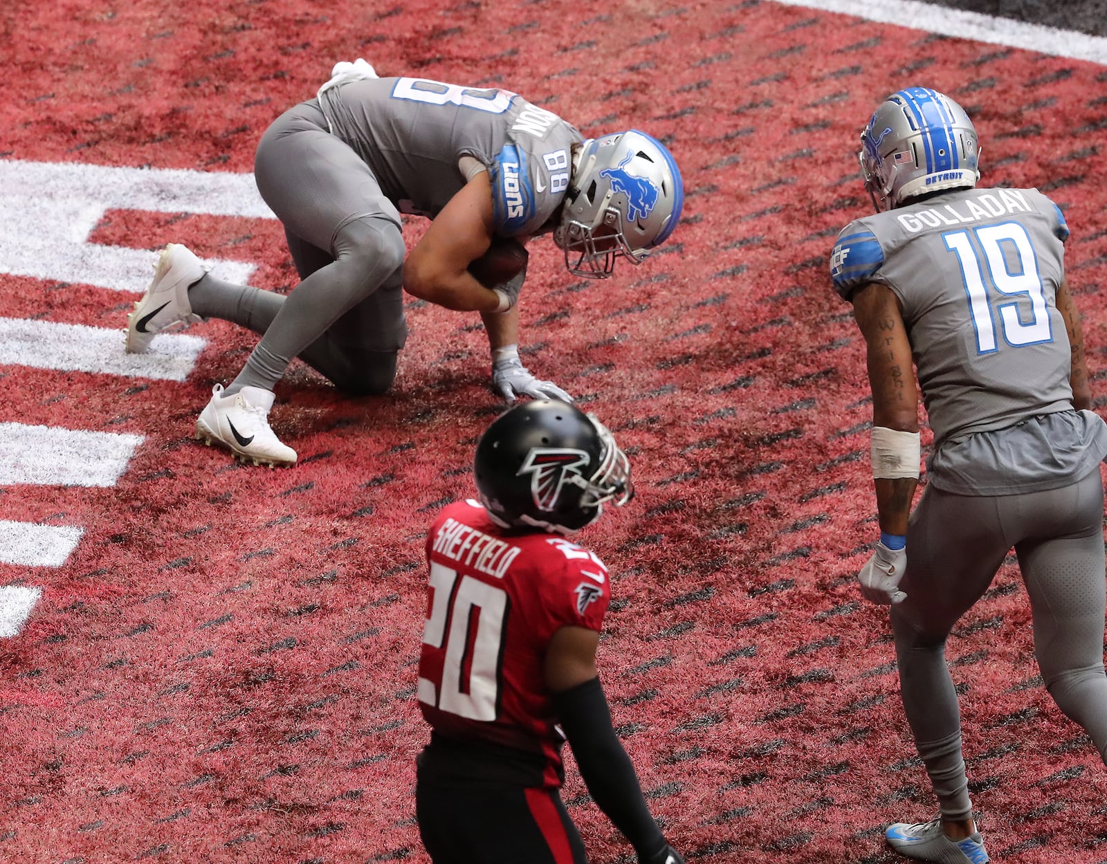 Falcons cornerback Kendall Sheffield reacts as Detroit Lions tight end T.J. Hockenson (left) scores a touchdown as time expires Sunday, Oct. 25, 2020, at Mercedes-Benz Stadium in Atlanta. (Curtis Compton / Curtis.Compton@ajc.com)