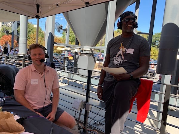 92.9/The Game mid-day hosts Andy Bunker and Randy McMichael on air during the 10th anniversary party for the station at New Realm Brewery October 22, 2022. RODNEY HO/rho@ajc.com