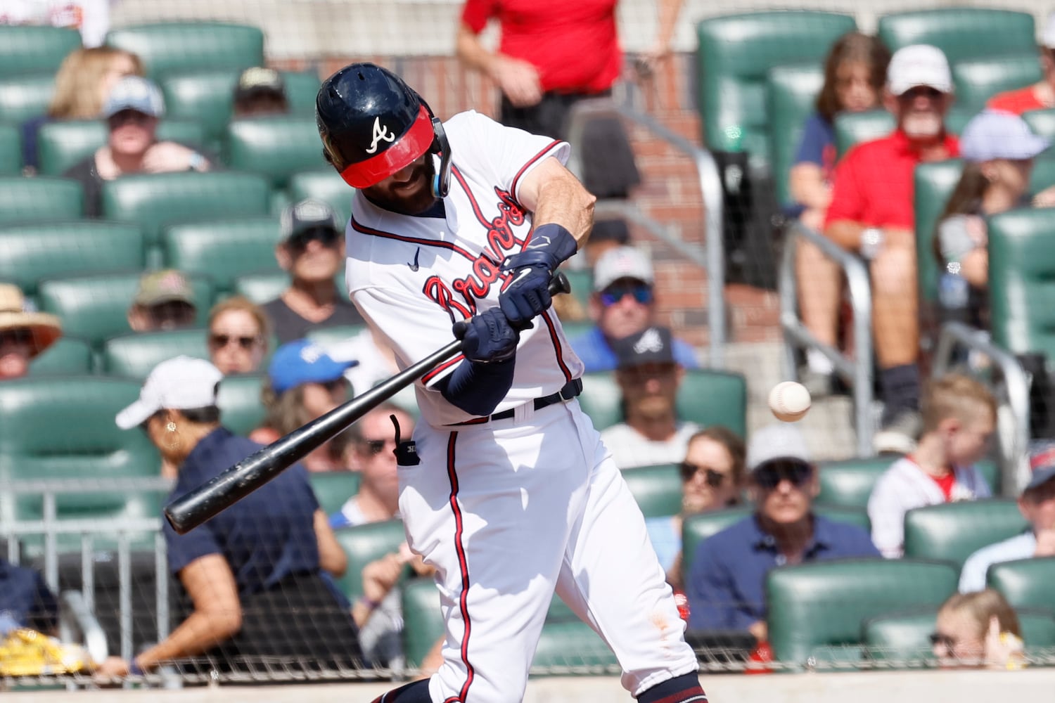 Braves shortstop Dansby Swanson connects during the sixth inning against the Phillies on Sunday at Truist Park. (Miguel Martinez / miguel.martinezjimenez@ajc.com)