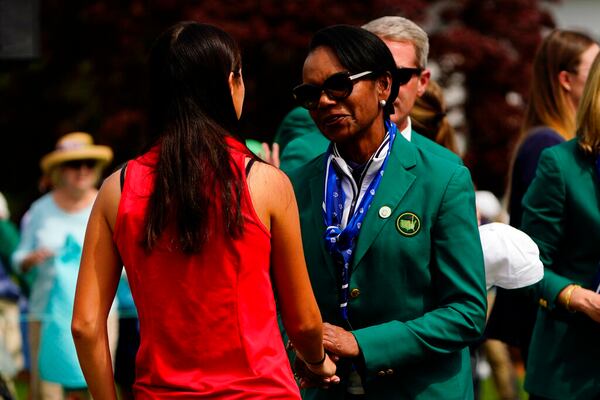 Former Secretary of State Condoleezza Rice, right, greets Anna Davis after Davis won the Augusta National Women's Amateur golf tournament, Saturday, April 2, 2022, in Augusta, Ga. (AP Photo/Matt Slocum)