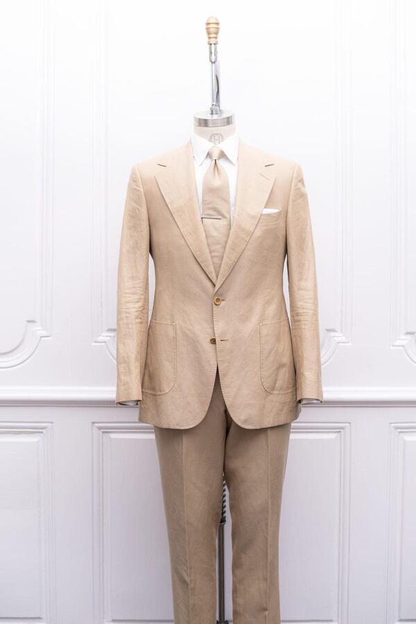 The Tan Solid Bennett Suit, available at men's bespoke clothier Maison Hideoki.