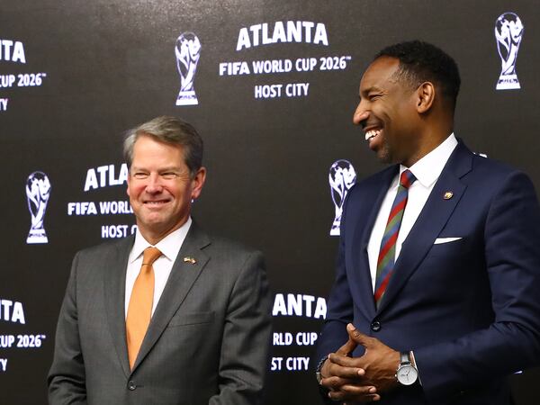 Gov. Brian Kemp (left) and Mayor Andre Dickens share a laugh during the Host City announcement news conference for the 2026 World Cup at Mercedes-Benz Stadium on Thursday, June 16, 2022, in Atlanta. (Curtis Compton/AJC)