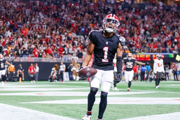 Atlanta Falcons wide receiver Darnell Mooney (1) reacts after his touchdown during the second half of an NFL football game against the Tampa Bay Buccaneers on Thursday, October 3, 2024, at Mercedes-Benz Stadium in Atlanta. 
(Miguel Martinez/ AJC)