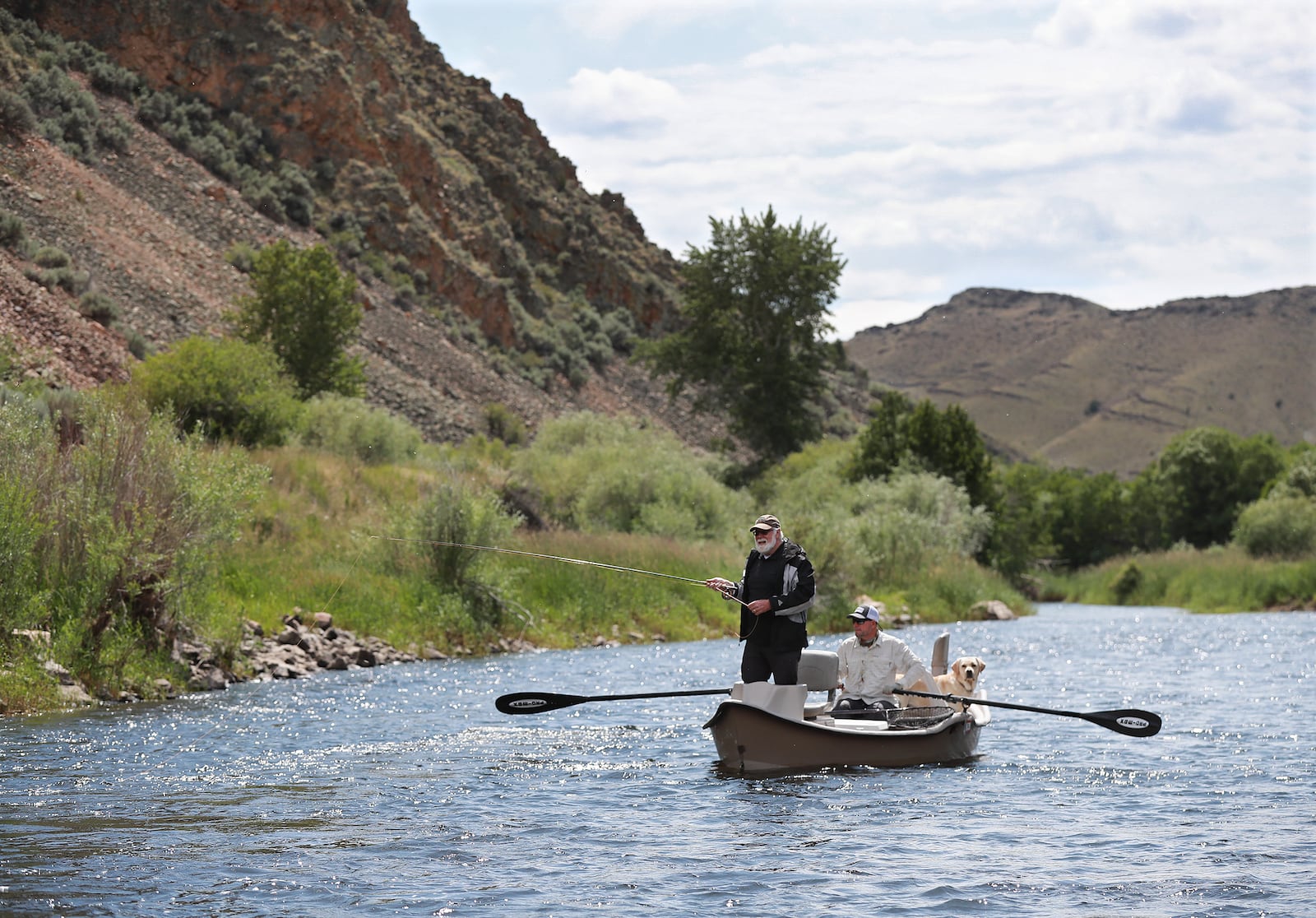 AJC writer Steve Hummer fishes for trout with guide Troy Buhr during a joint float trip with former Falcons quarterback Steve Bartkowski down the Big Hole River.  Curtis Compton/ccompton@ajc.com