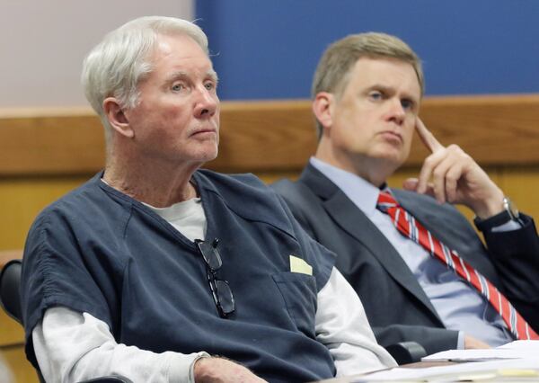 McIver with one of his attorneys, Joe Sharp, at Thursday’s hearing. BOB ANDRES /BANDRES@AJC.COM