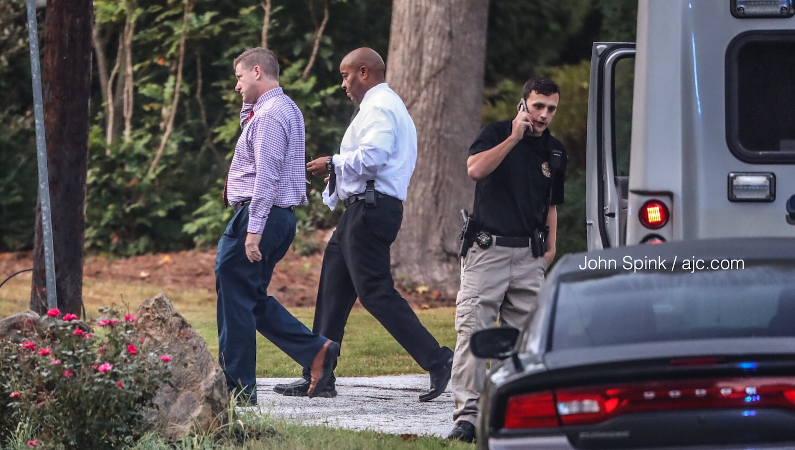 Rockdale County detectives gather evidence at the scene of a deadly shooting on White Oak Court. 